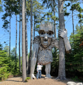 standing near giant troll